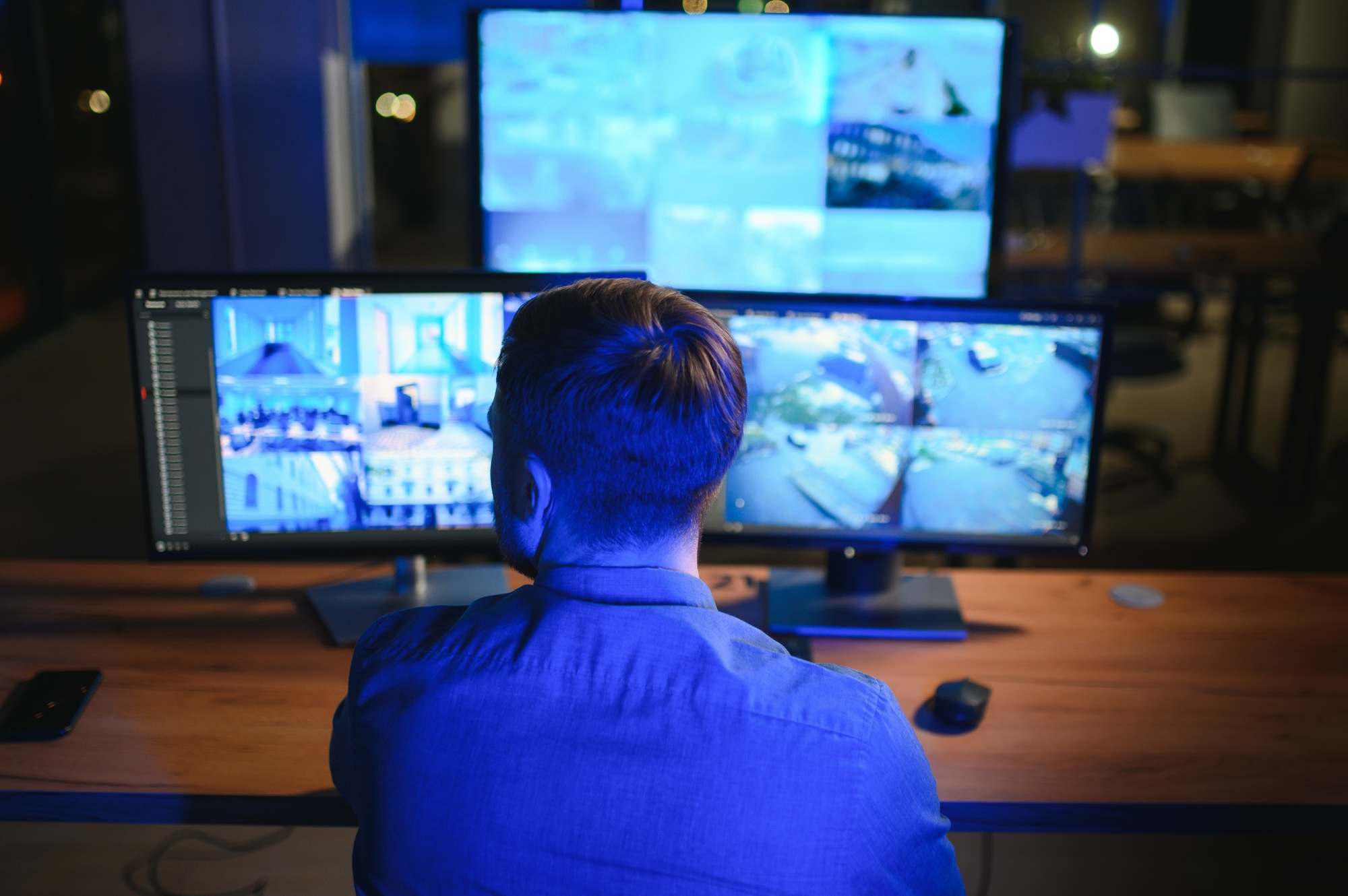 Male security guard in surveillance room